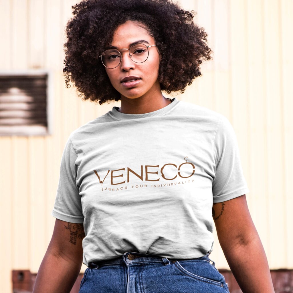 Bonus - Portrait Mockup of a Tattoed Black Woman with Curly Hair Wearing a Plus Size T-shirt in City Outdoors Wearing Glasses