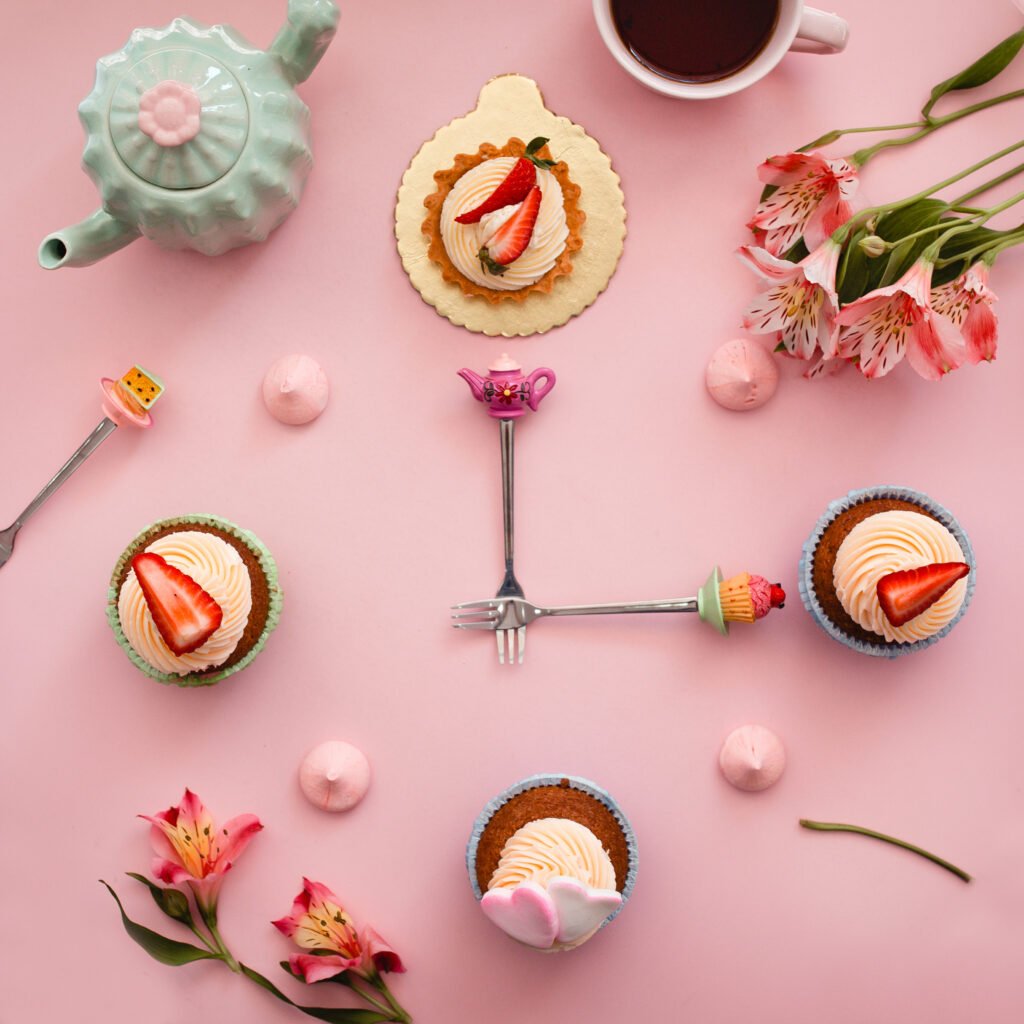 sweet clock from cakes with strawberries