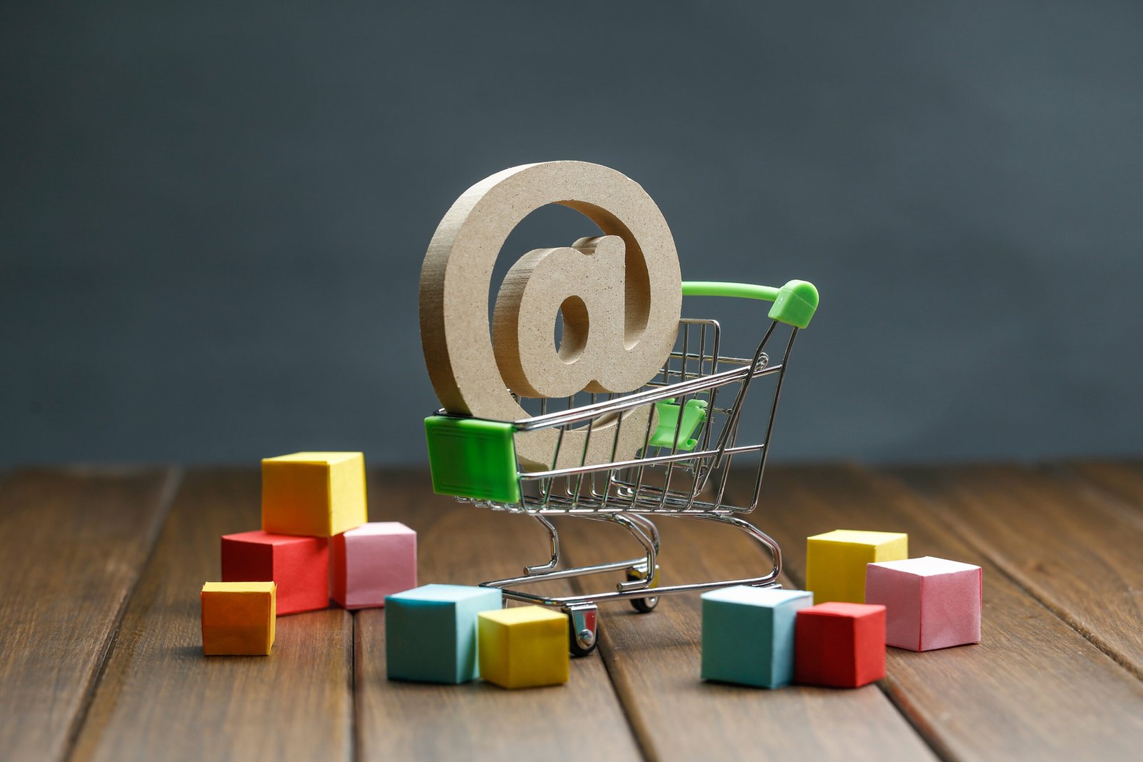 wooden symbol @ in shopping cart, Online shopping concept