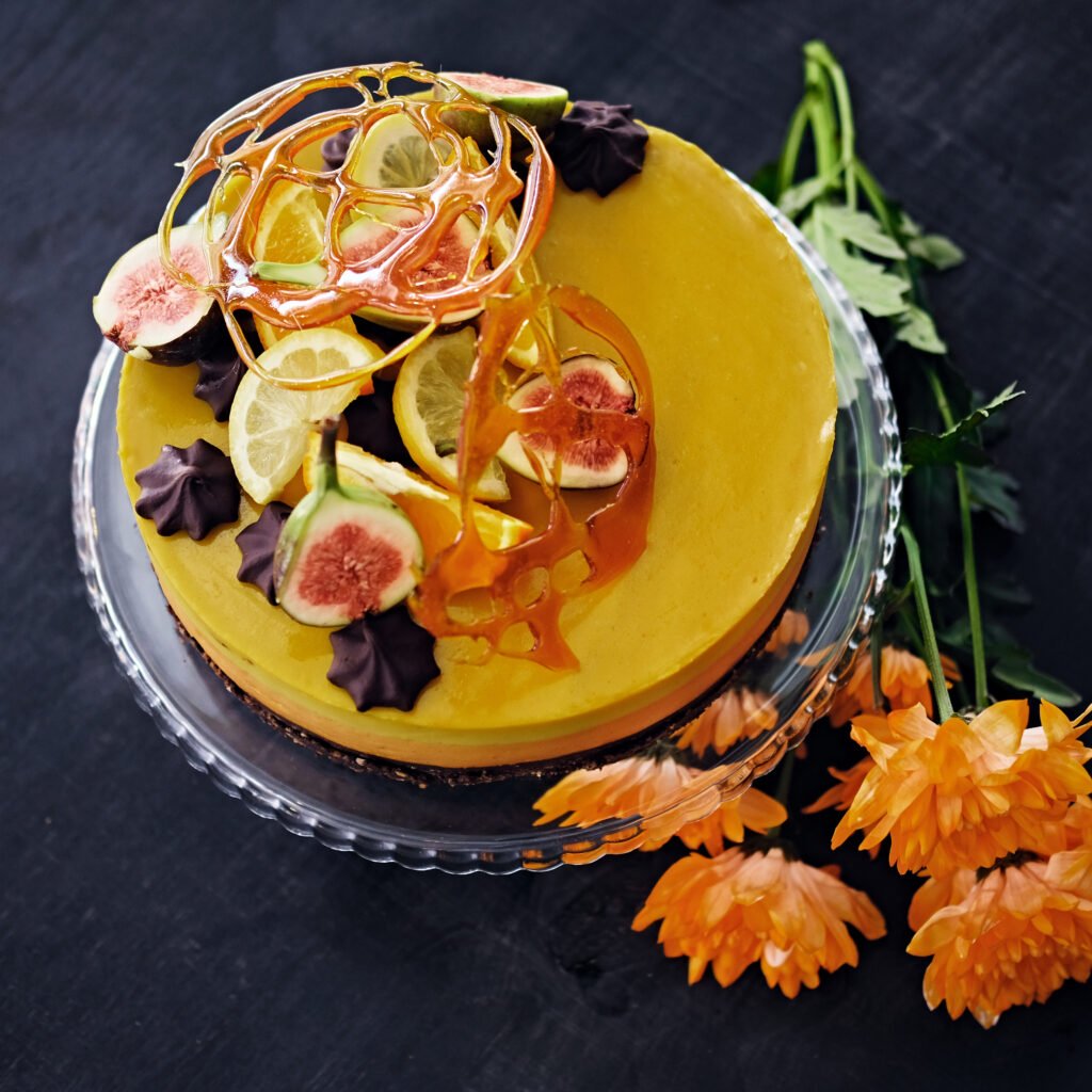 Yellow creme cake with different fruits.